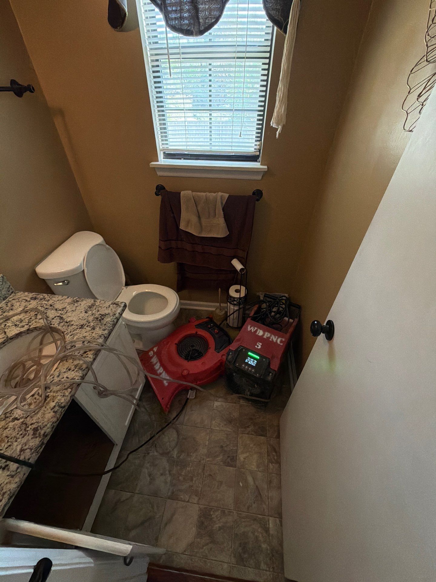 What Should You Avoid Doing Immediately After Water Damage? 4 Bathroom Water Damage Drying Equipment With Air Mover And Dehumidifier Setup