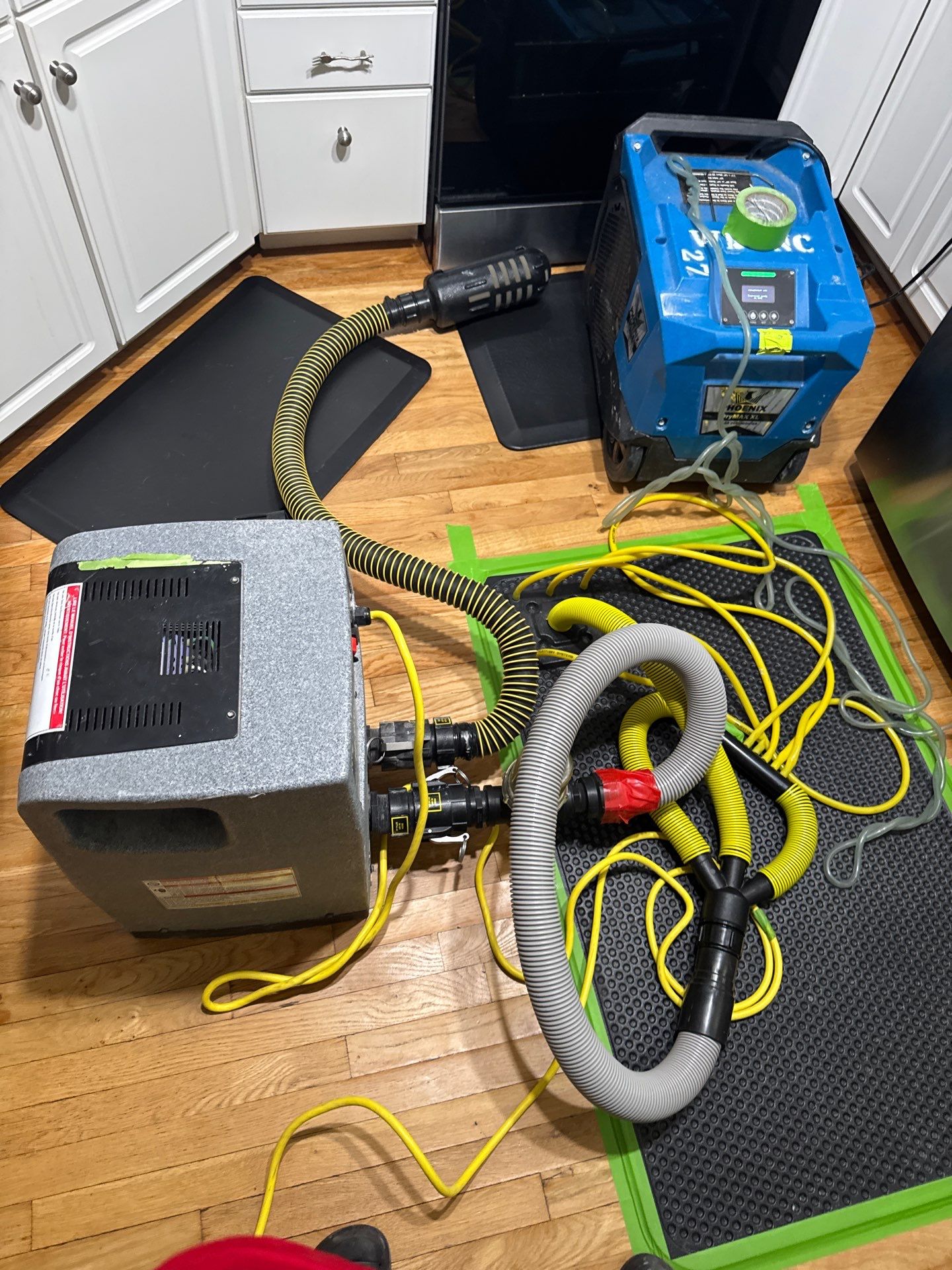 What Should You Do Immediately After Water Damage In Greensboro? 7 Hardwood Floor Water Damage Drying Equipment With Floor Mats And Dehumidifier Setup